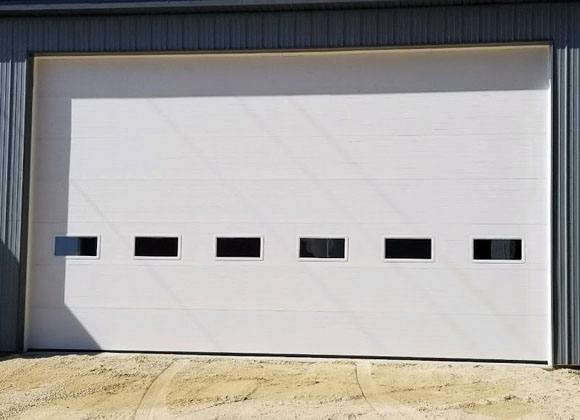 a white overhead door after being repaired by Overhead Door Companies in Green Bay, WI